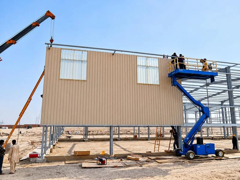 Installation of wall cladding around the structural frame