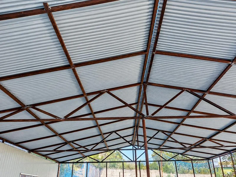 AIMS School & College steel roofing — Fabricated steel trusses, profiled metal-sheet roofing and maintenance